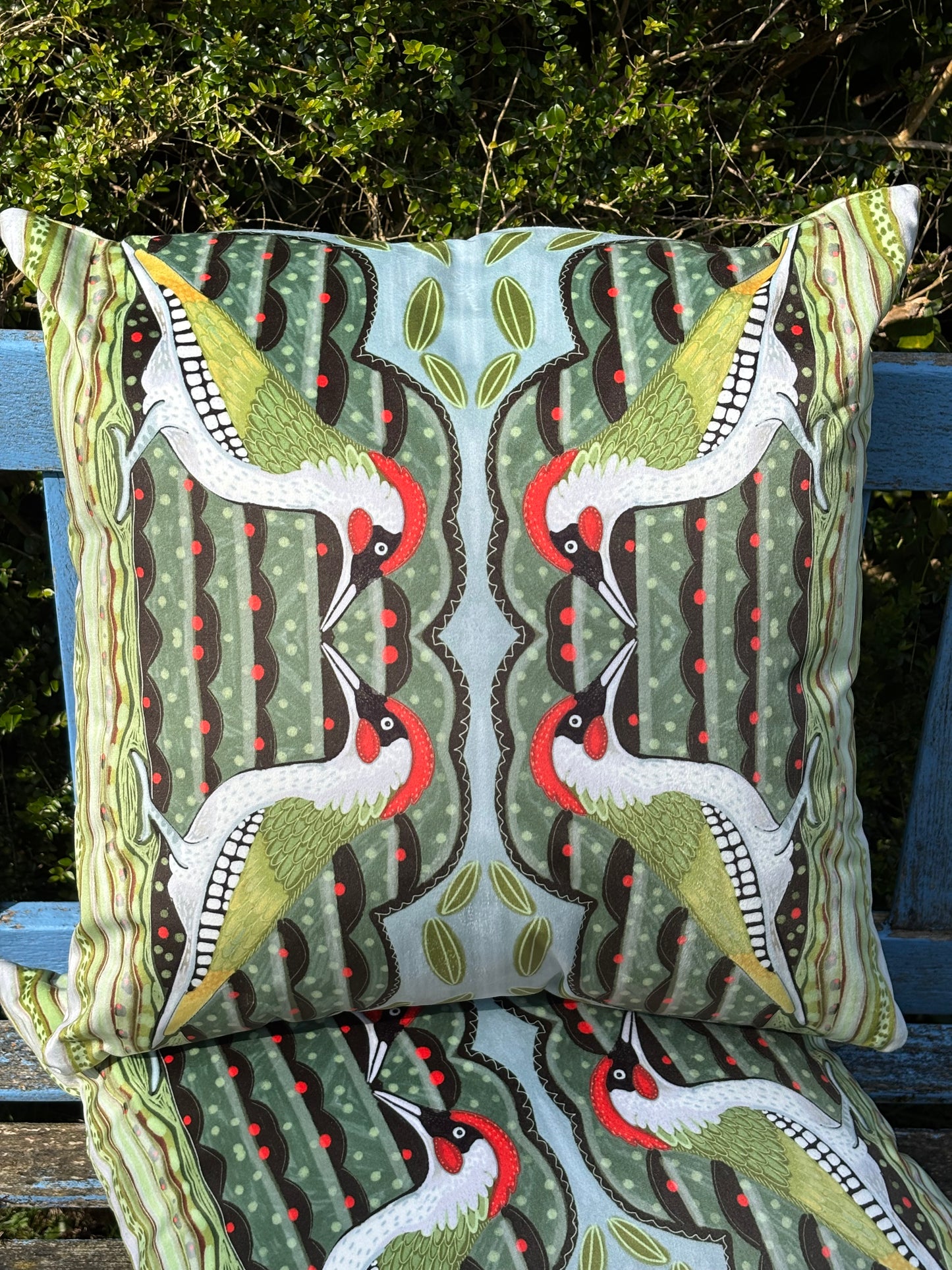 Green woodpecker faux suede cushion.