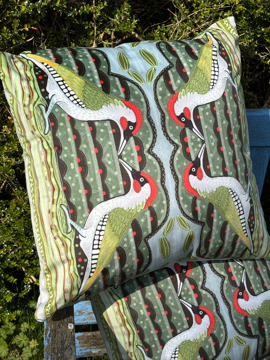 Green woodpecker faux suede cushion.