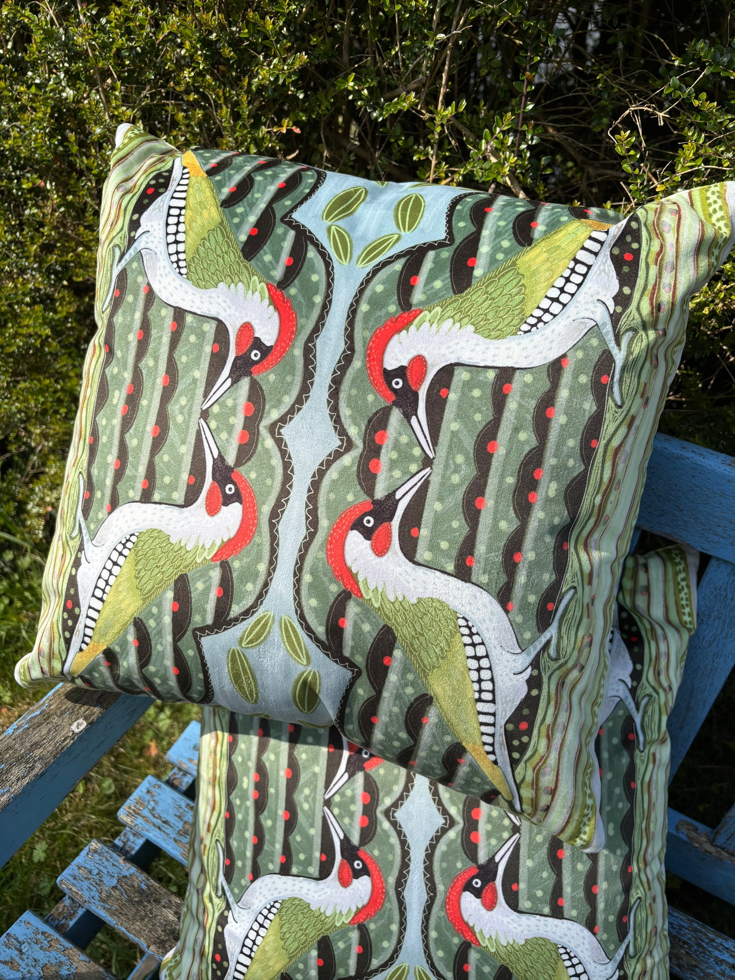 Green woodpecker faux suede cushion.